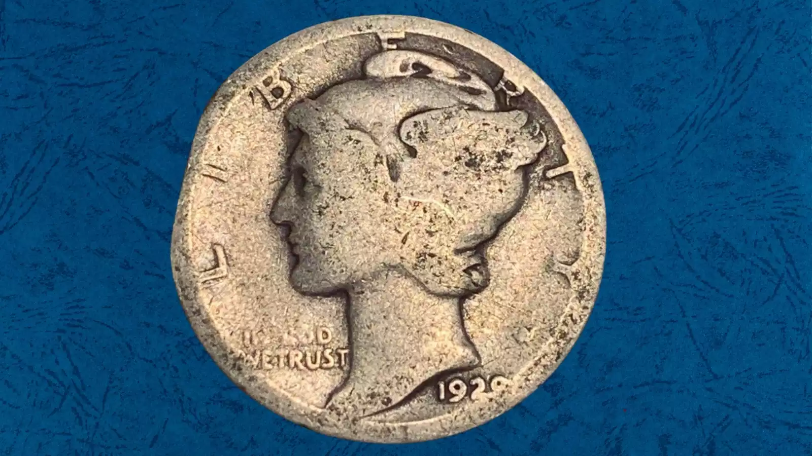 1928 Mercury dime clipped planchet error showing curved missing edge section and Blakesley Effect rim weakness opposite the clip