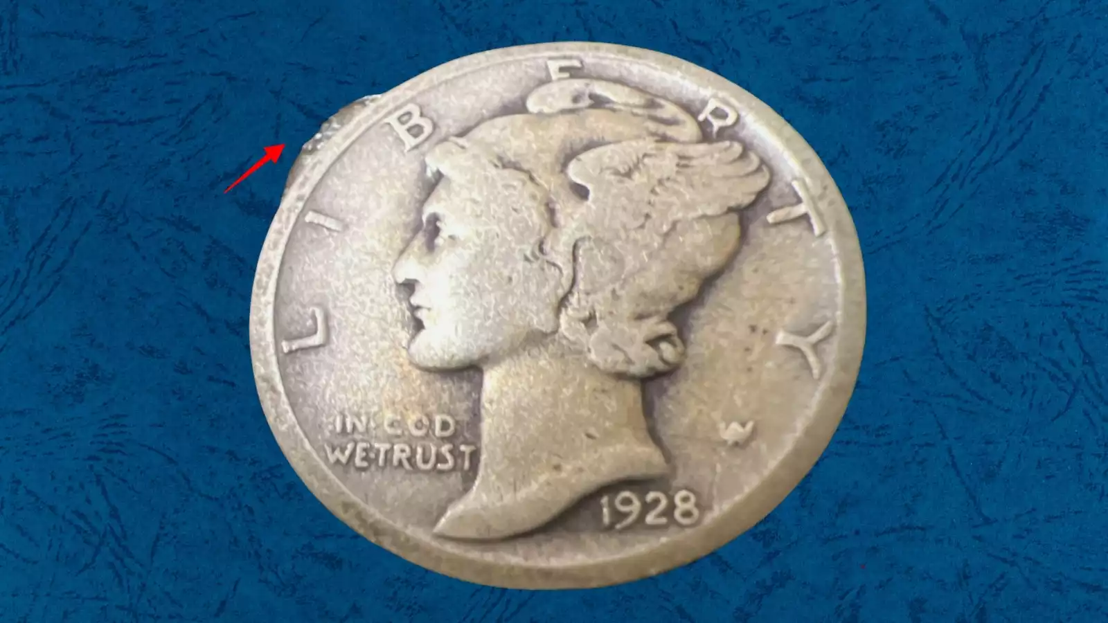 1928 Mercury dime die break cud error showing raised featureless area near rim where die fragment broke away during production